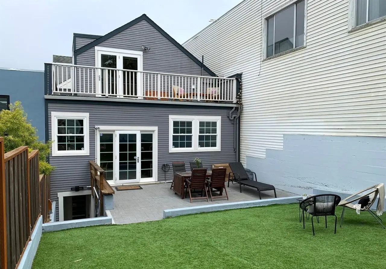 The rear deck, patio, and lawn
